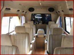 interior of a passenger van of New Roshan Travels